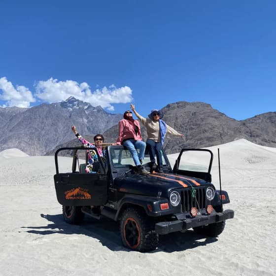 Skardu tour guests enjoying the beautiful mountain scenery